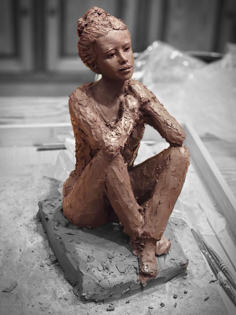 Seated figure — terracotta, contemplative gaze
